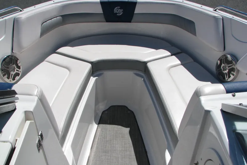 Slide: The Image of 2020 Chaparral 23 Surf boat interior with cushioned seating and speakers. - 3