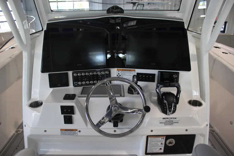 Slide: The Image of 2026 Sea Fox 328 Commander boat interior with open storage drawer. - 22