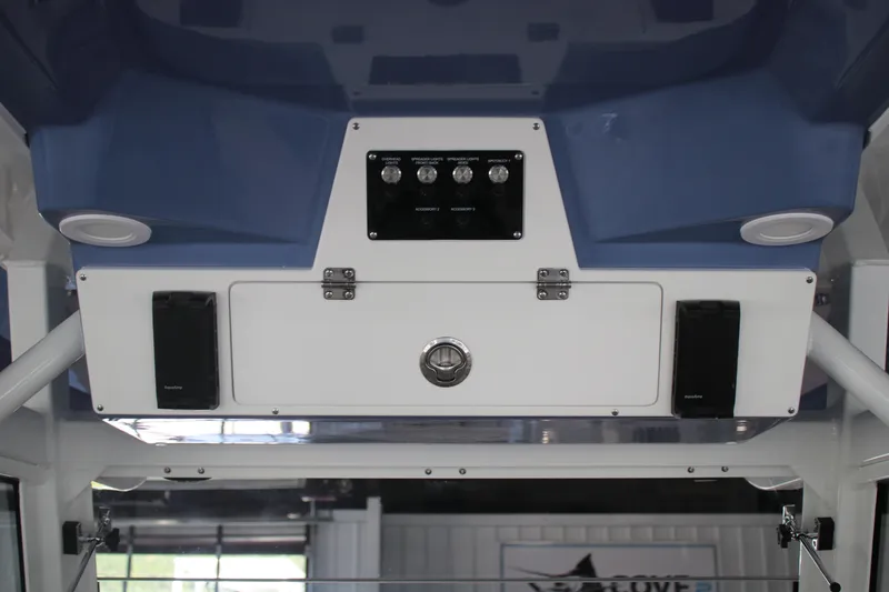 Slide: The Image of 2026 Sea Fox 328 Commander boat interior with dual outboard engines and seating area. - 23