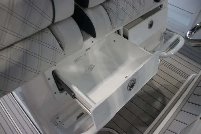 Slide: The Image of 2026 Sea Fox 328 Commander boat interior with dual outboard engines and seating area. - 24