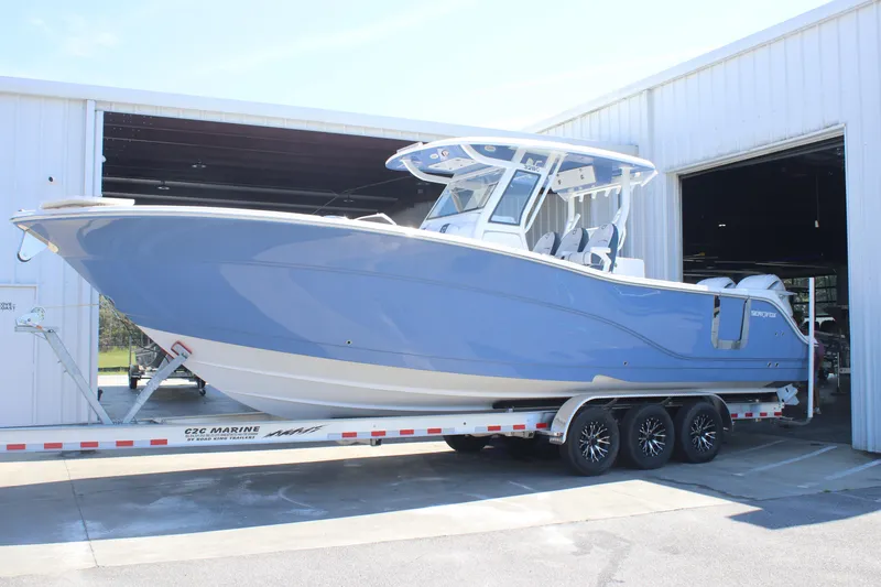 Slide: The Image of 2026 Sea Fox 328 Commander boat interior with open storage compartments and speakers. - 3