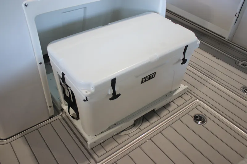 Slide: The Image of 2026 Sea Fox 328 Commander boat interior with storage compartment and cup holders. - 34