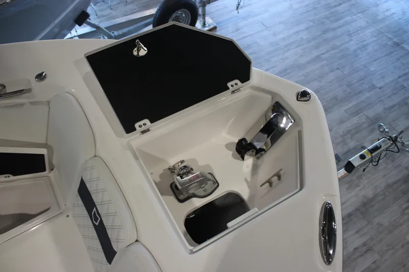 Slide: The Image of 2026 Sea Fox 328 Commander boat interior with open storage compartment. - 6