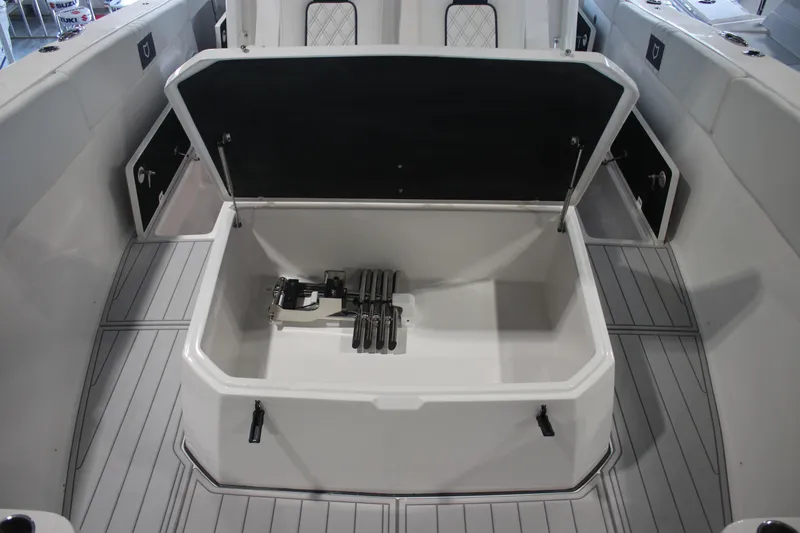 Slide: The Image of 2026 Sea Fox 328 Commander boat interior with storage compartment and speaker. - 8