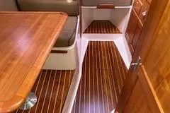 Slide: The Image of 2005 Hunt Yachts Surfhunter 33 interior with wooden flooring and seating area. - 23