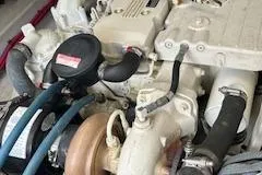 Slide: The Image of Engine of 2005 Hunt Yachts Surfhunter 33 with visible hoses and components. - 27