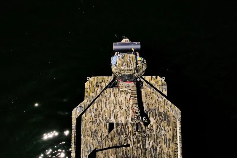 Slide: The Image of Top view of 2026 SeaArk 1752 Slayer X Pro boat on dark water. - 14