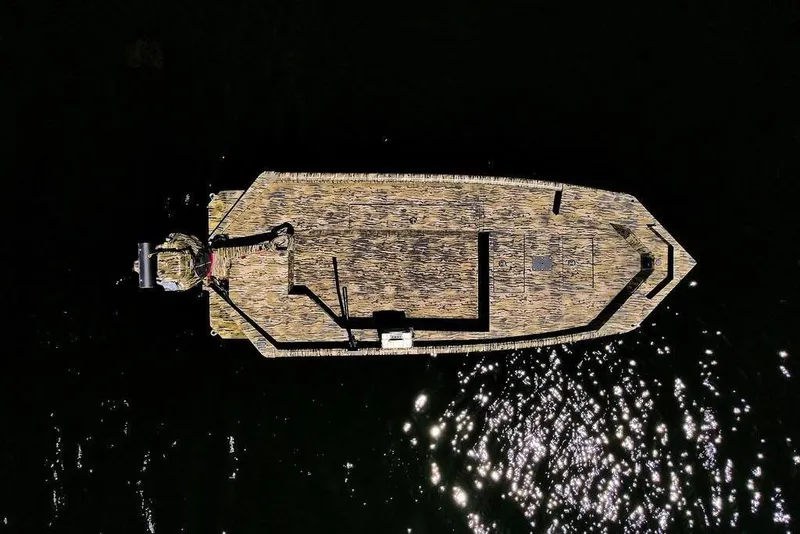 Slide: The Image of 2026 SeaArk 1752 Slayer X Pro boat with camouflage deck design. - 4