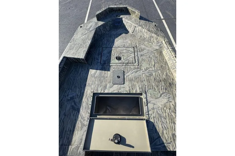 Slide: The Image of 2026 SeaArk 1752 Slayer X Pro boat interior with camouflage design. - 9