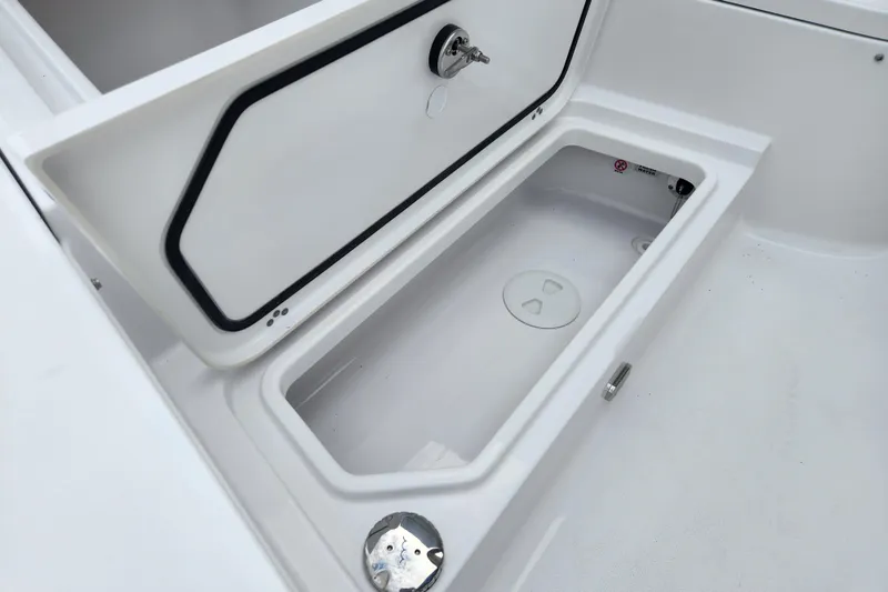 Slide: The Image of Open storage compartment on 2026 Sportsman Masters 227 Bay Boat. - 14