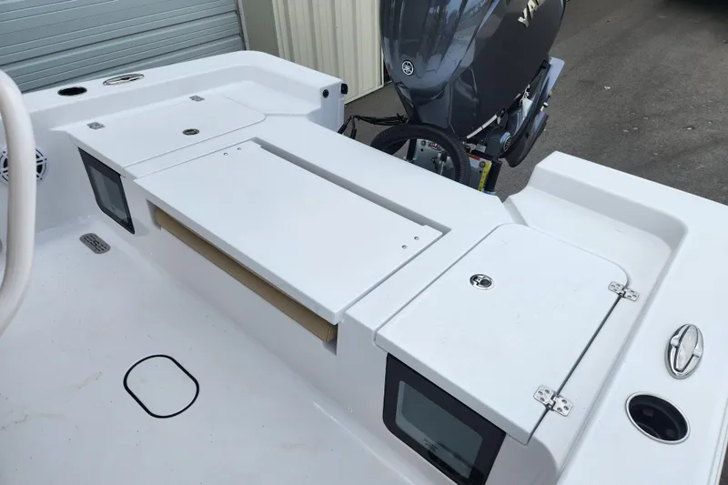 Slide: The Image of 2026 Sportsman Masters 227 Bay Boat with Yamaha engine, featuring spacious deck and storage compartments. - 24