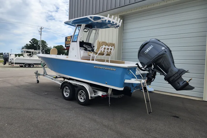 Slide: The Image of 2026 Sportsman Masters 227 Bay Boat with Yamaha engine, parked on trailer. - 3