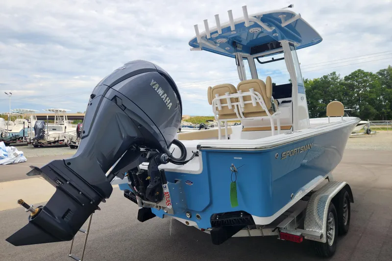 Slide: The Image of 2026 Sportsman Masters 227 Bay Boat with Yamaha engine on trailer, blue and white design. - 4
