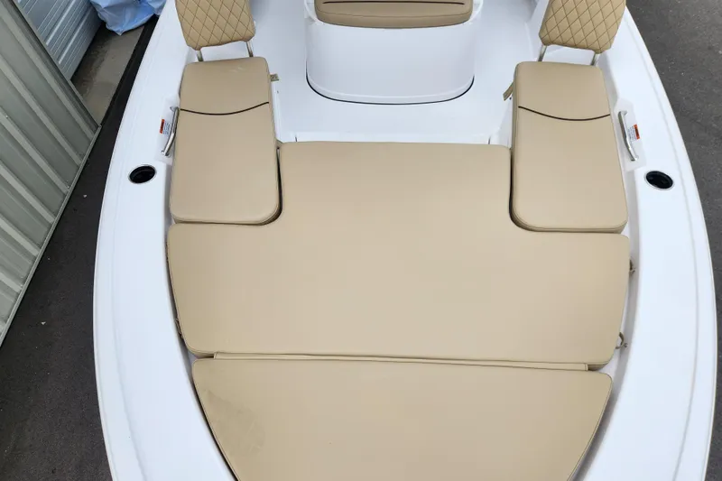Slide: The Image of 2026 Sportsman Masters 227 Bay Boat with beige cushioned seating. - 8
