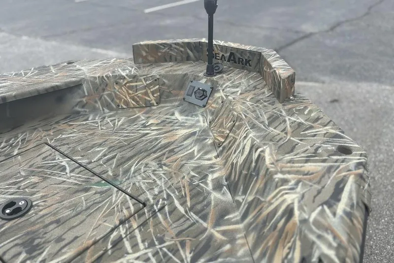 Slide: The Image of 2026 SeaArk 1752 Slayer X boat with Mercury engine in parking lot. - 11