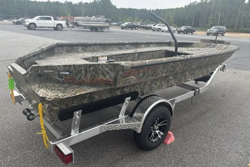 Slide: The Image of 2026 SeaArk 1752 Slayer X boat with camouflage design and Mercury outboard motor. - 4