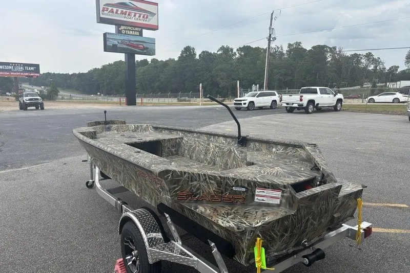 Slide: The Image of 2026 SeaArk 1752 Slayer X boat with Mercury 60 HP engine in parking lot. - 5