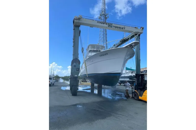 Slide: The Image of 1979 Hatteras 53 Motor Yacht, close-up of deck and rigging against cloudy sky. - 18