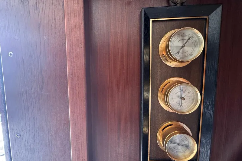 Slide: The Image of Vintage brass gauges on 1979 Hatteras 53 Motor Yacht wooden panel. - 39