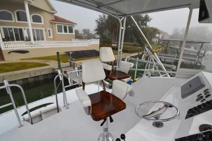 Slide: The Image of 1979 Hatteras 53 Motor Yacht stern view with fishing chair and deck in Gulfport, FL. - 4