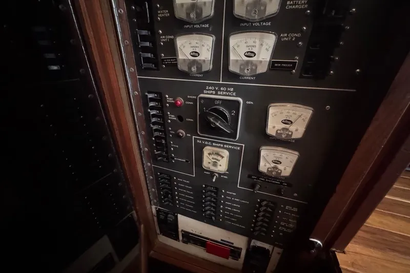 Slide: The Image of Electrical control panel on a 1979 Hatteras 53 Motor Yacht, featuring various gauges and switches. - 44