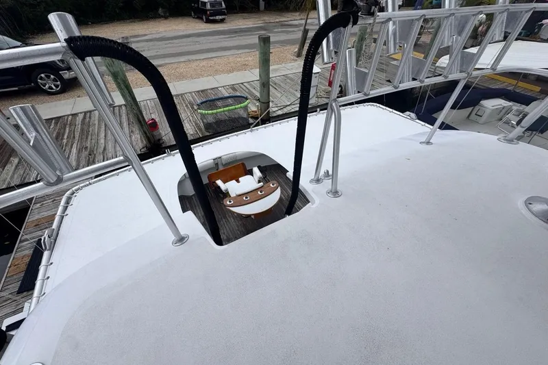 Slide: The Image of 1979 Hatteras 53 Motor Yacht deck with ladder and dock view. - 75
