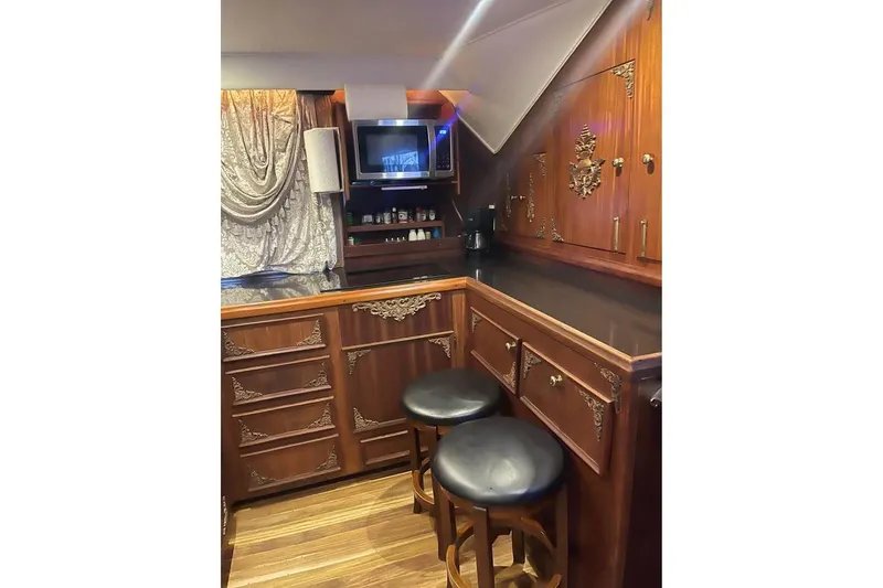 Slide: The Image of 1979 Hatteras 53 Motor Yacht, side view with sleek white exterior and windows. - 8