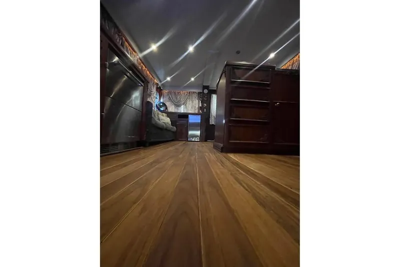 Slide: The Image of 1979 Hatteras 53 Motor Yacht side view with sleek windows and railing. - 9