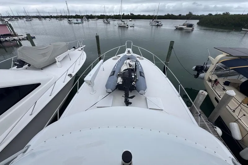 Slide: The Image of 1979 Hatteras 53 Motor Yacht docked with inflatable boat on deck. - 93