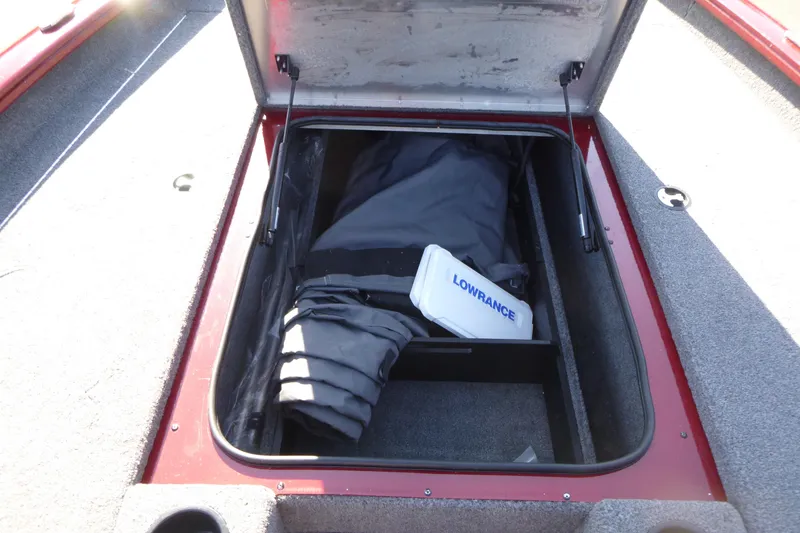Slide: The Image of 2020 Tracker Pro Team 190 TX boat storage compartment with Lowrance equipment. - 12