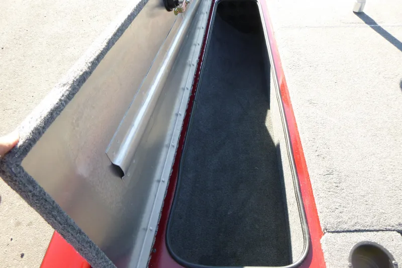 Slide: The Image of Open storage compartment of 2020 Tracker Pro Team 190 TX boat, showing interior space. - 13