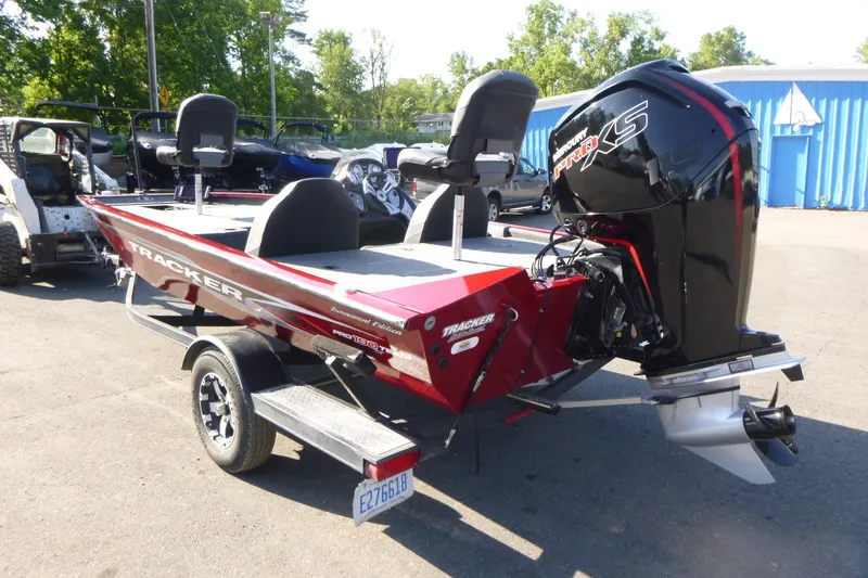 Slide: The Image of 2020 Tracker Pro Team 190 TX boat with Mercury Pro XS engine, parked outdoors. - 3