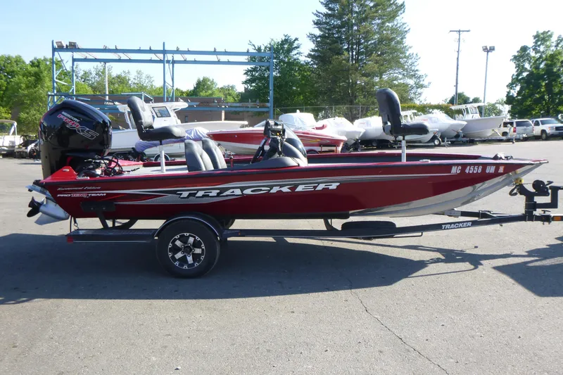 Slide: The Image of 2020 Tracker Pro Team 190 TX boat in a parking lot, side view. - 4