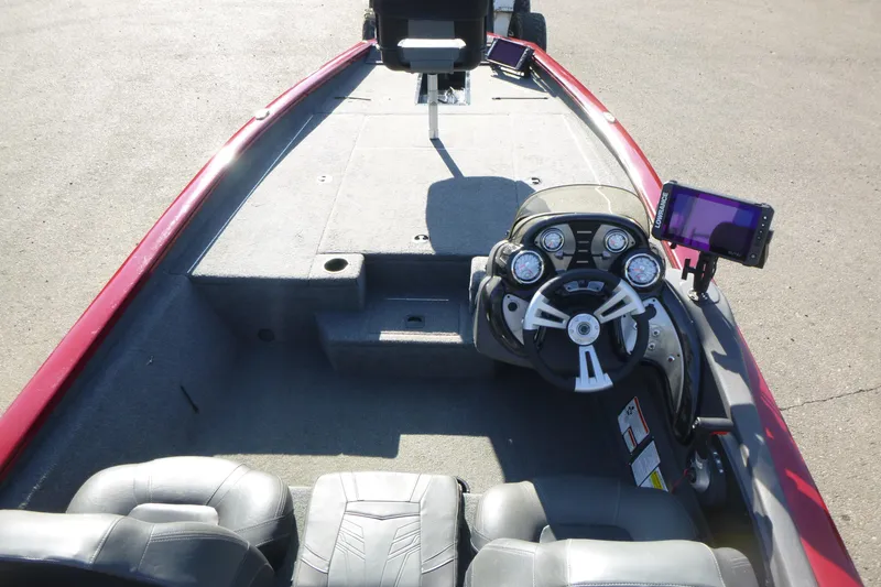 Slide: The Image of 2020 Tracker Pro Team 190 TX boat interior with steering console and seating. - 5