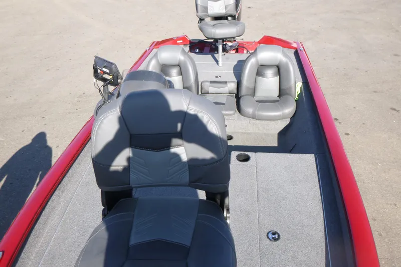 Slide: The Image of 2020 Tracker Pro Team 190 TX boat interior with gray seating and red accents. - 6