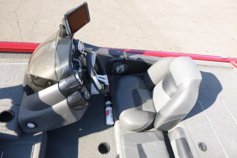 Slide: The Image of 2020 Tracker Pro Team 190 TX boat interior with steering console and seating. - 7
