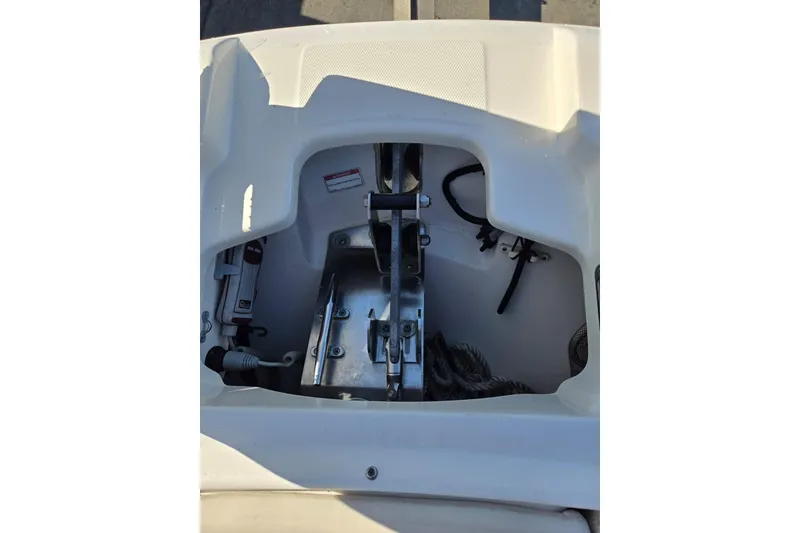 Slide: The Image of Anchor compartment of 2014 Boston Whaler 270 Vantage boat, showing equipment and ropes. - 22