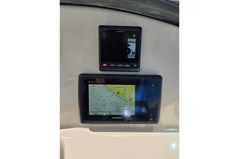 Slide: The Image of Garmin navigation displays on 2014 Boston Whaler 270 Vantage boat dashboard. - 23