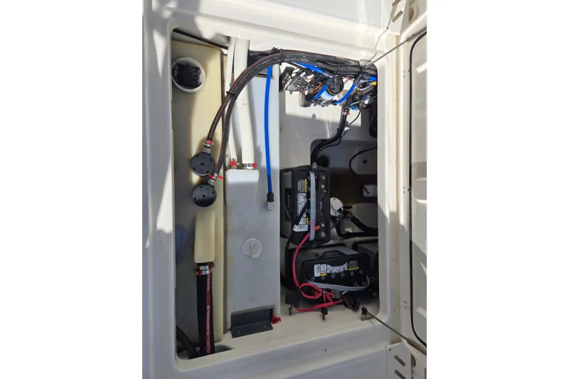 Slide: The Image of 2014 Boston Whaler 270 Vantage engine compartment with wiring and battery setup. - 45