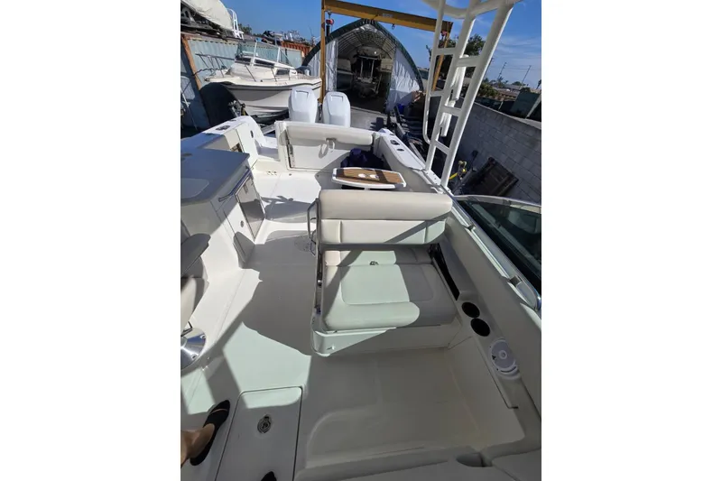 Slide: The Image of 2014 Boston Whaler 270 Vantage boat interior with seating and storage compartments. - 48