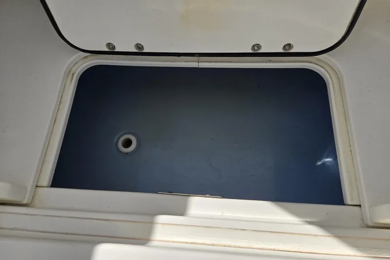 Slide: The Image of Open storage compartment on a 2014 Boston Whaler 270 Vantage boat. - 51