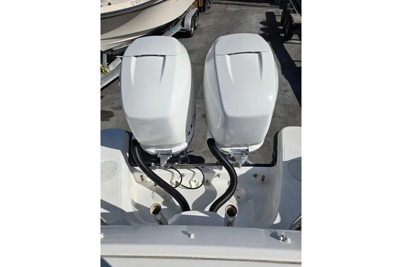 Slide: The Image of 2014 Boston Whaler 270 Vantage with dual outboard engines, rear view. - 55