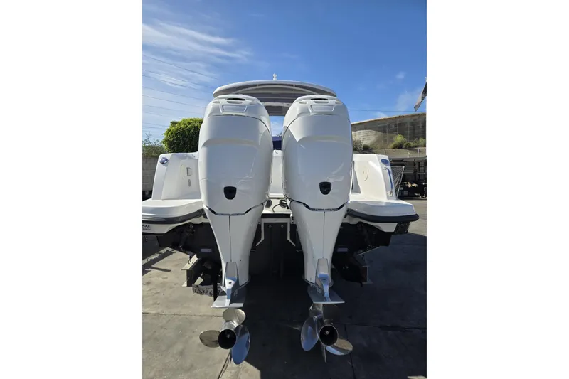 Slide: The Image of 2014 Boston Whaler 270 Vantage with dual outboard engines, rear view. - 56
