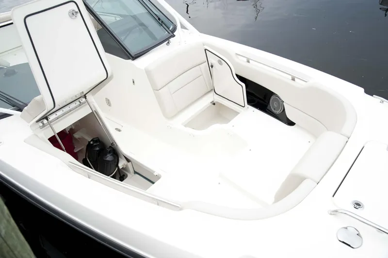 Slide: The Image of Manufacturer Provided Image: 2014 Boston Whaler 270 Vantage boat interior with open storage compartments. - 8