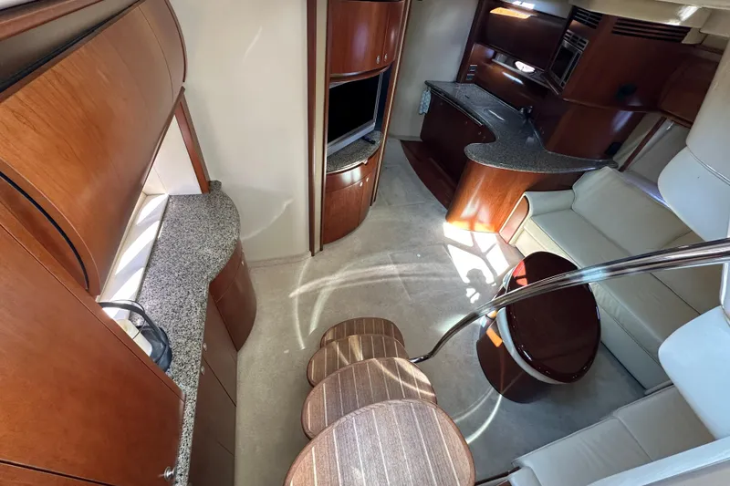 Slide: The Image of Luxurious interior of 2006 Sea Ray 52 Sundancer yacht with elegant wood finishes. - 16