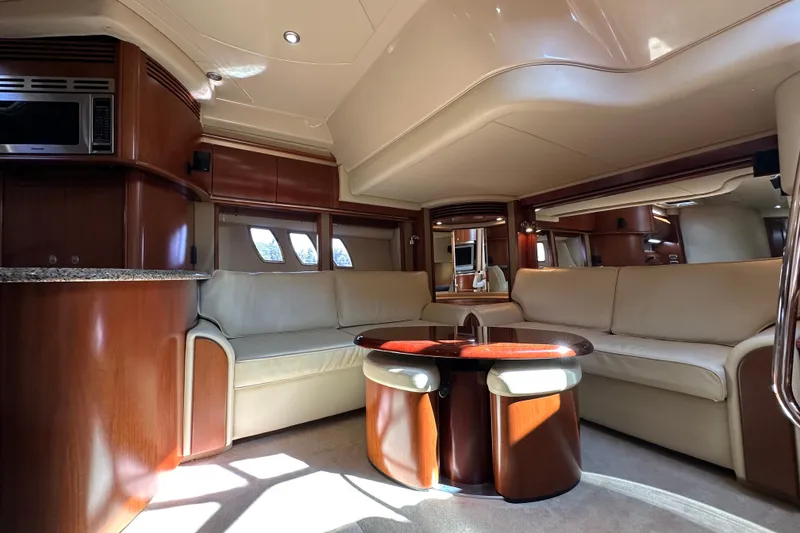 Slide: The Image of Luxurious interior of 2006 Sea Ray 52 Sundancer yacht with elegant seating and modern amenities. - 18