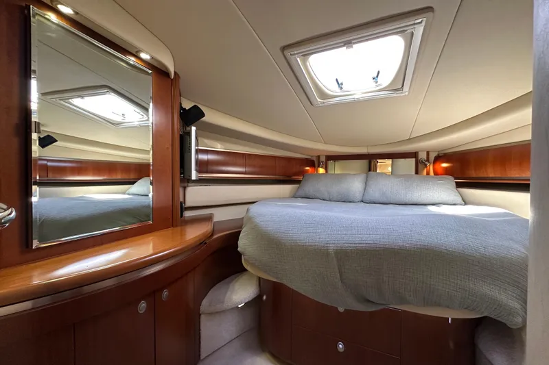 Slide: The Image of Luxurious cabin interior of 2006 Sea Ray 52 Sundancer yacht with elegant wood finishes. - 22