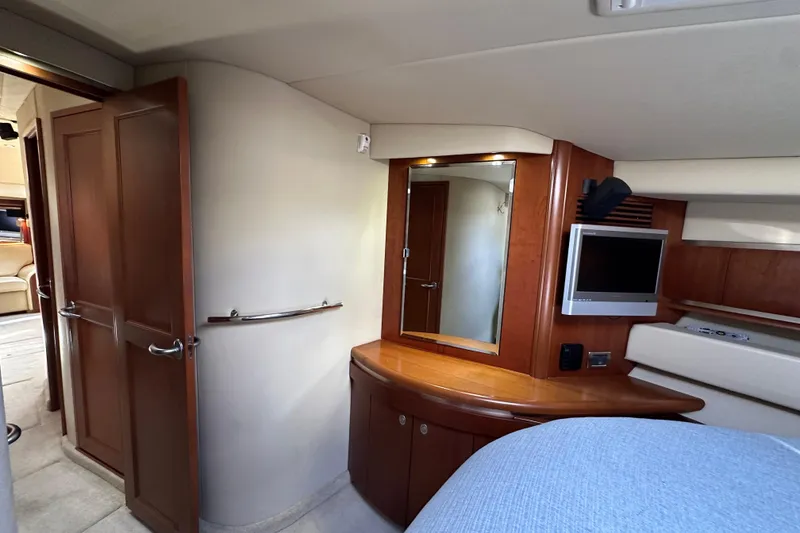 Slide: The Image of Luxurious interior of 2006 Sea Ray 52 Sundancer yacht with wood accents and modern amenities. - 24