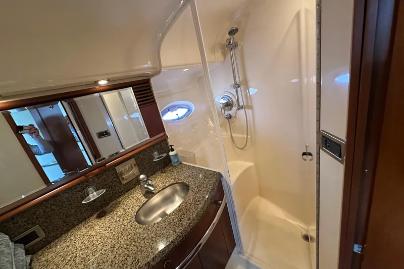 Slide: The Image of Luxurious bathroom in 2006 Sea Ray 52 Sundancer yacht with granite countertop and shower. - 25