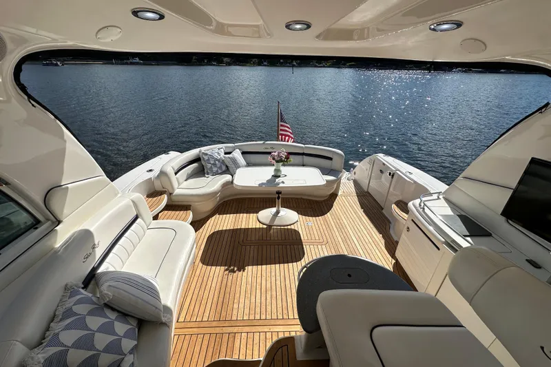 Slide: The Image of Luxurious 2006 Sea Ray 52 Sundancer yacht interior with elegant seating and scenic water view. - 7